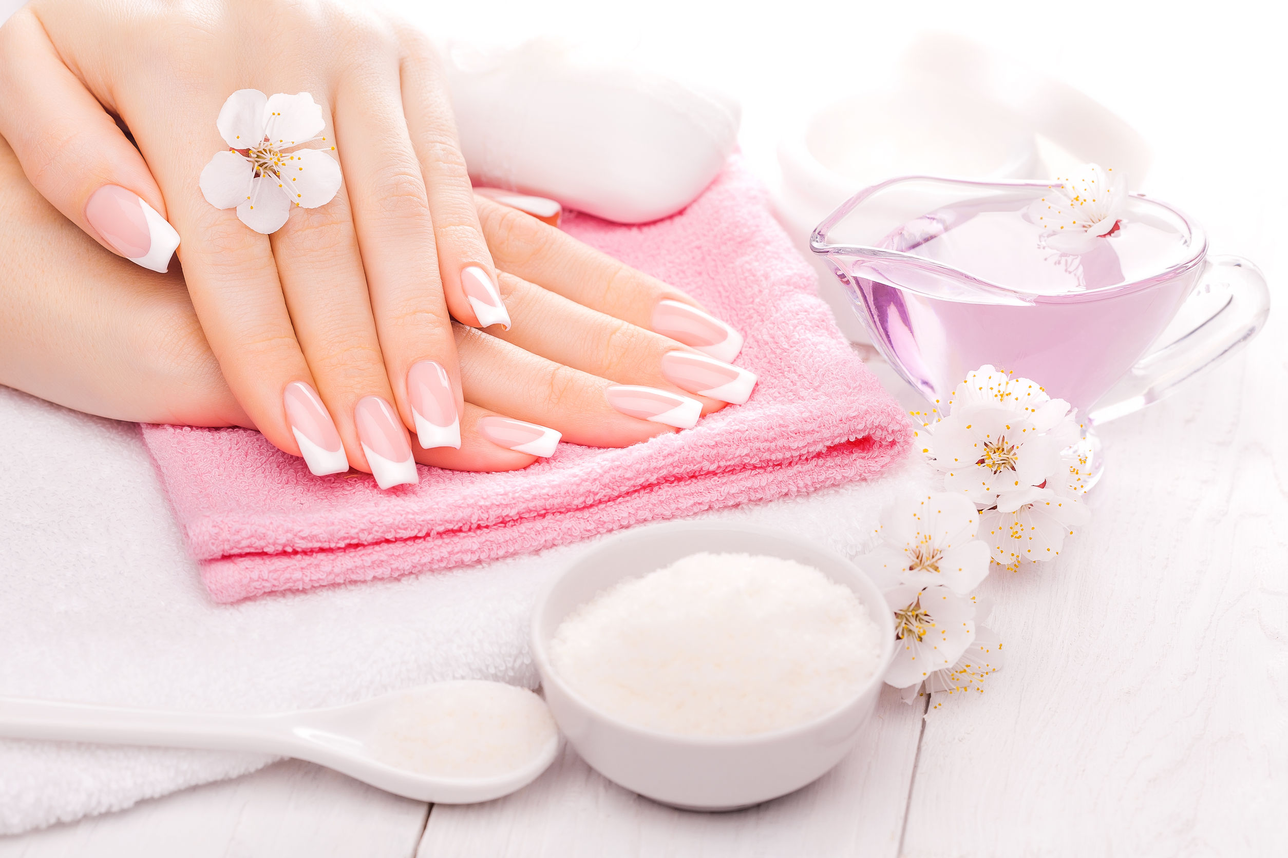 39600576 - french manicure with essential oils, apricot flowers. spa