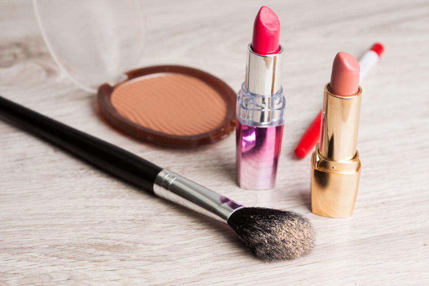 27925931 - various cosmetics on wooden table
